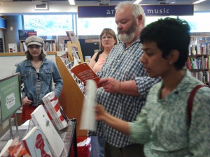 Students from the UW Digital Publishing Certificate class examine books that were printed on the Book Espresso Machine at UW-Seattle Bookstore